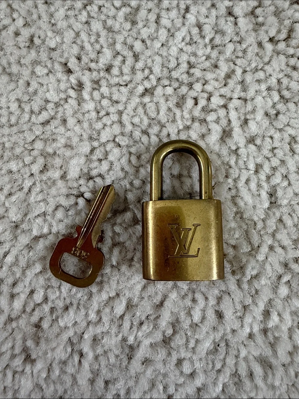 Louis Vuitton Gold Lock